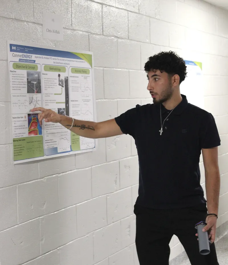 Chris Al-Rahi presenting a research poster at CanmetENERGY