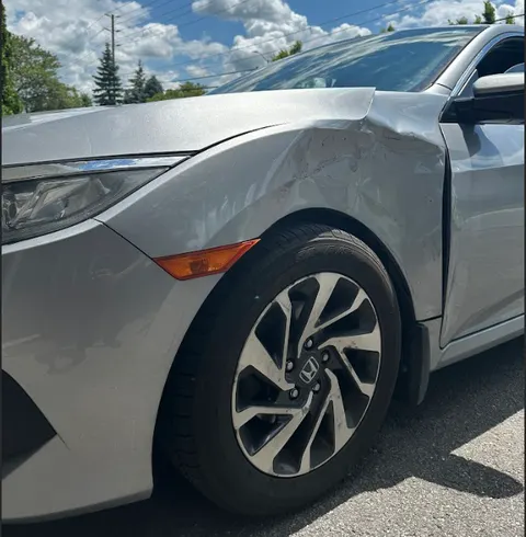 Cracked car fender before repair
