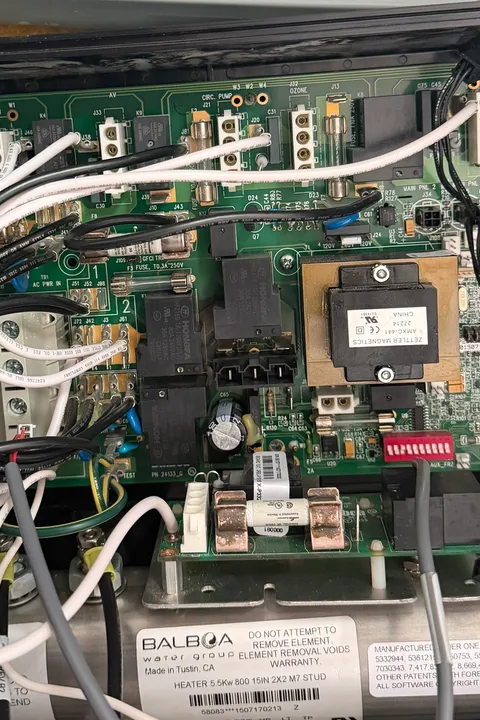 Repaired control board back in the hot tub with the new heater port soldered in