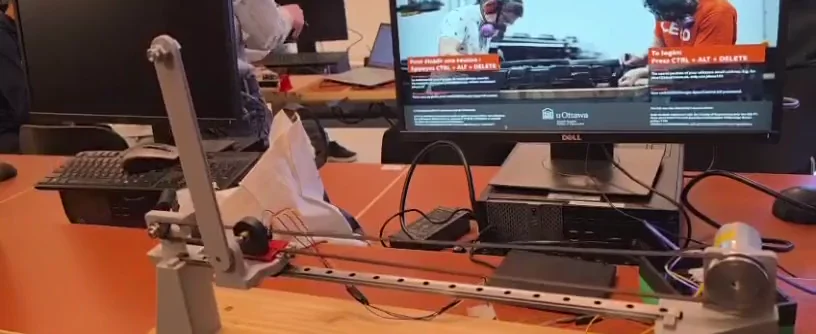 The inverted pendulum rig balancing on its rail in the controls lab
