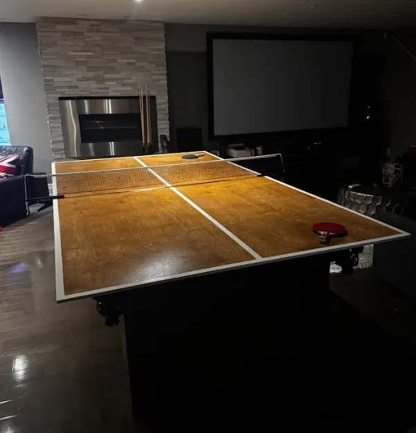 Foldable ping-pong table top mounted on a pool table